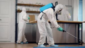 group of exterminators working at a home