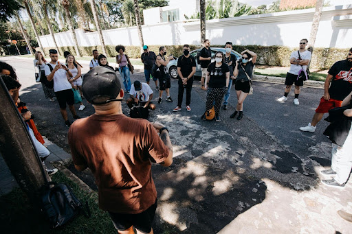 person speaking to a group ourdoors